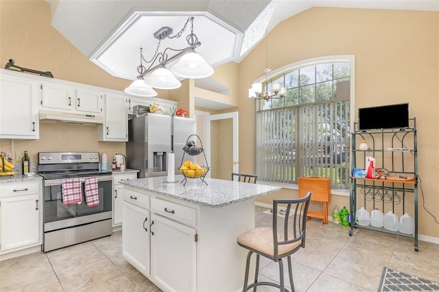 1910 Palm View Dr, Apopka, FL 32712 - kitchen with appliances with stainless steel finishes, under cabinet range hood, a chandelier, white cabinets, and light tile patterned floors