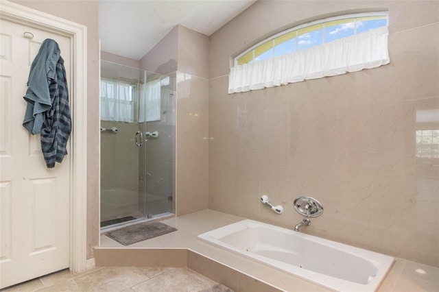 1910 Palm View Dr, Apopka, FL 32712 - bathroom with a bath, a shower stall, and tile patterned floors
