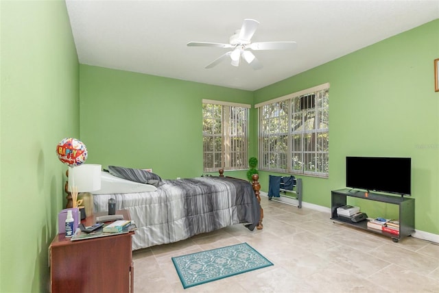 1910 Palm View Dr, Apopka, FL 32712 - bedroom with baseboards, tile patterned flooring, and a ceiling fan