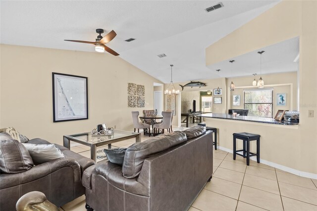 109 Coral Reef Ct N, Palm Coast, FL 32137 - living area with vaulted ceiling, light tile patterned floors, a chandelier, a ceiling fan, and baseboards