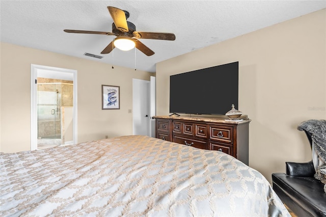 109 Coral Reef Ct N, Palm Coast, FL 32137 - bedroom featuring ensuite bathroom, ceiling fan, and a textured ceiling