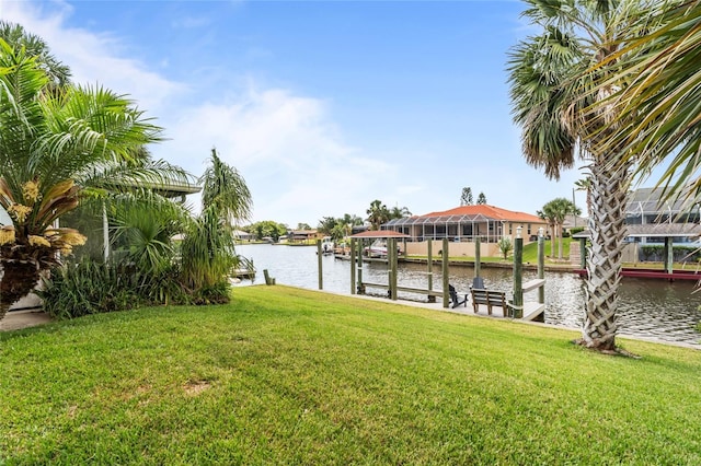 109 Coral Reef Ct N, Palm Coast, FL 32137 - dock with a water view, a lawn, and boat lift