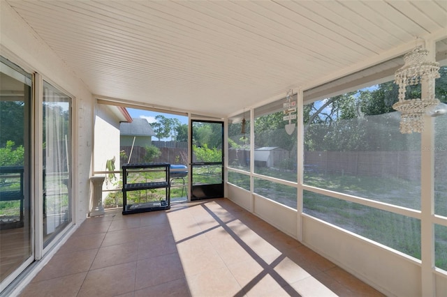 925 S Dean Cir, Deltona, FL 32738 - unfurnished sunroom featuring a chandelier
