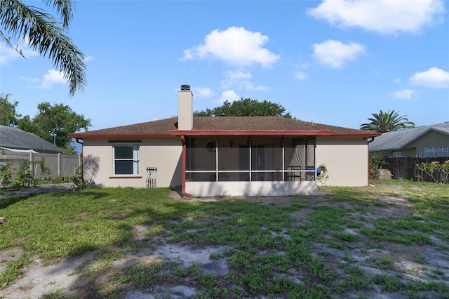 925 S Dean Cir, Deltona, FL 32738 - rear view of house with a chimney, a sunroom, and stucco siding
