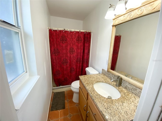 bathroom with toilet, vanity, a shower with curtain, and tile patterned flooring