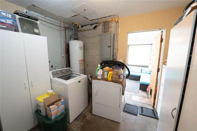 laundry area featuring water heater, washing machine and dryer, electric panel, and a textured ceiling