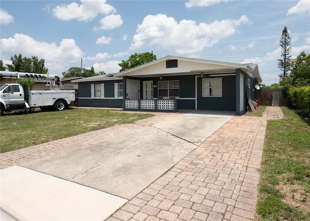 view of front of home featuring covered porch, ceiling fan, and concrete driveway