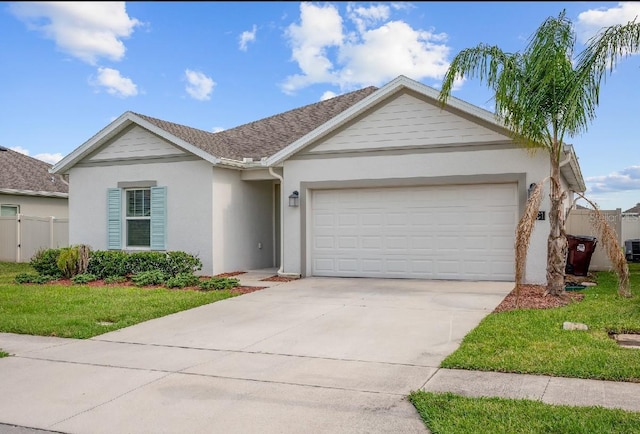 601 Watusi Way, Saint Cloud, FL 34772 - view of front of home with stucco siding, a garage, and concrete driveway