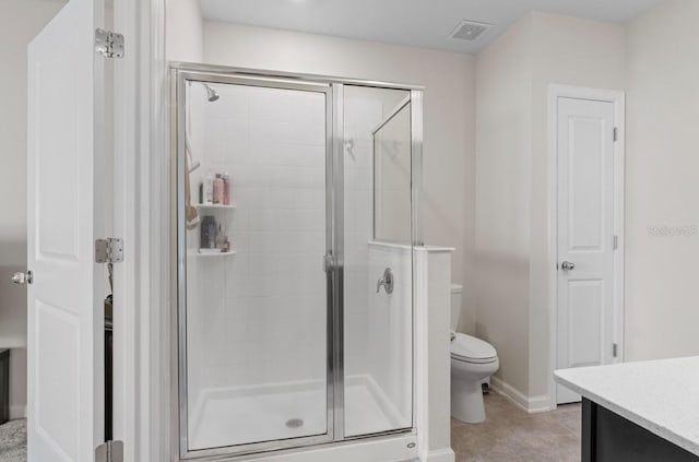 601 Watusi Way, Saint Cloud, FL 34772 - bathroom with a stall shower, vanity, toilet, baseboards, and tile patterned flooring