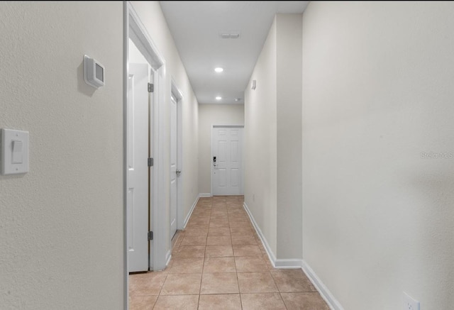 601 Watusi Way, Saint Cloud, FL 34772 - corridor with light tile patterned floors, baseboards, and recessed lighting