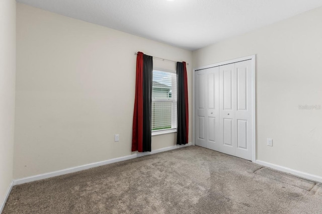 601 Watusi Way, Saint Cloud, FL 34772 - unfurnished bedroom featuring carpet, baseboards, and a closet