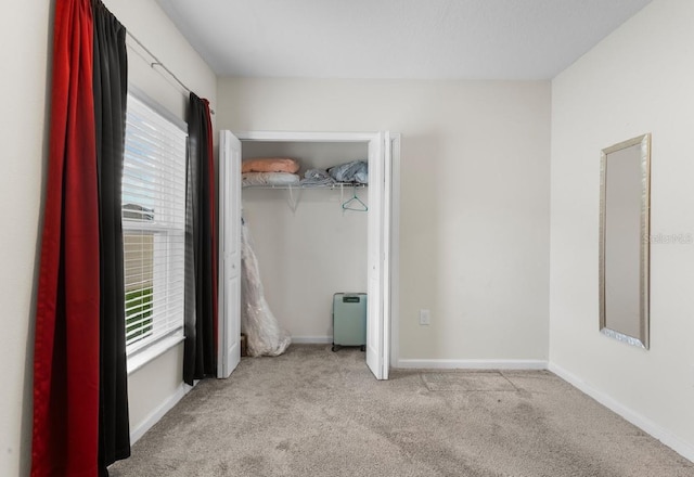 601 Watusi Way, Saint Cloud, FL 34772 - unfurnished bedroom with carpet floors, baseboards, and a closet