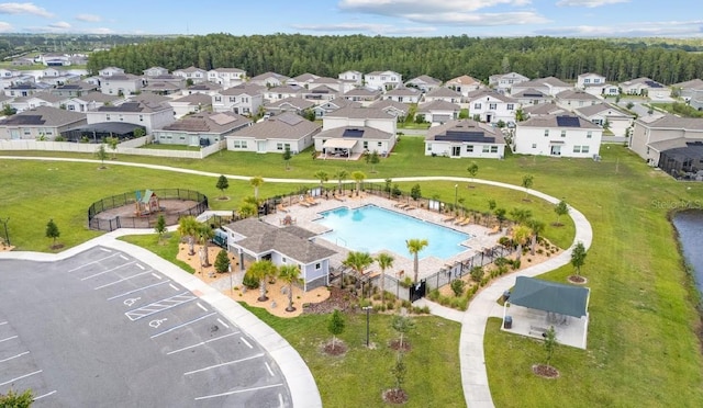 601 Watusi Way, Saint Cloud, FL 34772 - aerial overview of property's location with a pool area and nearby suburban area