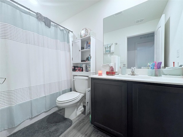 1713 Redfin Way, Kissimmee, FL 34759 - bathroom featuring toilet, vanity, wood finished floors, and shower / bath combination with curtain