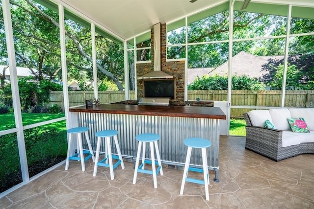 3009 Ridgevale Cir, Valrico, FL 33596 - sunroom with vaulted ceiling, healthy amount of natural light, and an outdoor hangout area