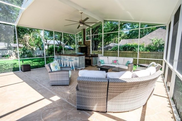 3009 Ridgevale Cir, Valrico, FL 33596 - fenced backyard with an outdoor living space with a fire pit, a patio area, and a ceiling fan