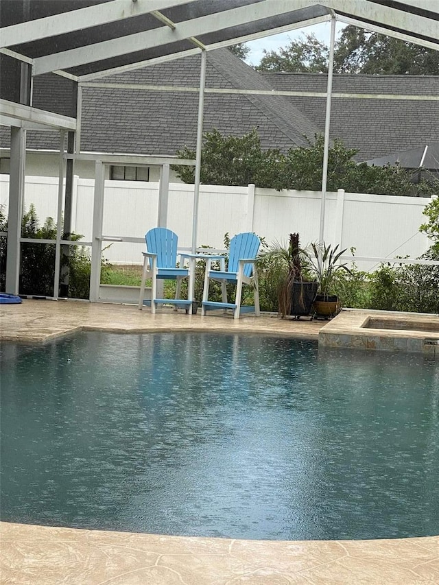 3009 Ridgevale Cir, Valrico, FL 33596 - view of swimming pool with glass enclosure and a pool with connected hot tub