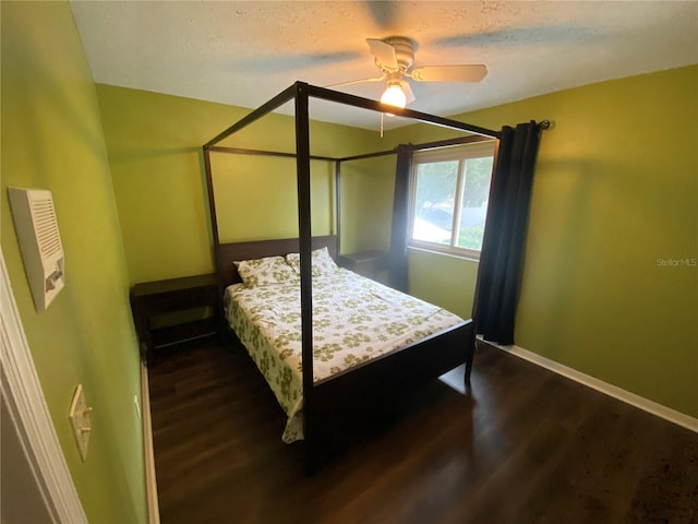 3009 Ridgevale Cir, Valrico, FL 33596 - bedroom with dark wood-type flooring, baseboards, a textured ceiling, and ceiling fan
