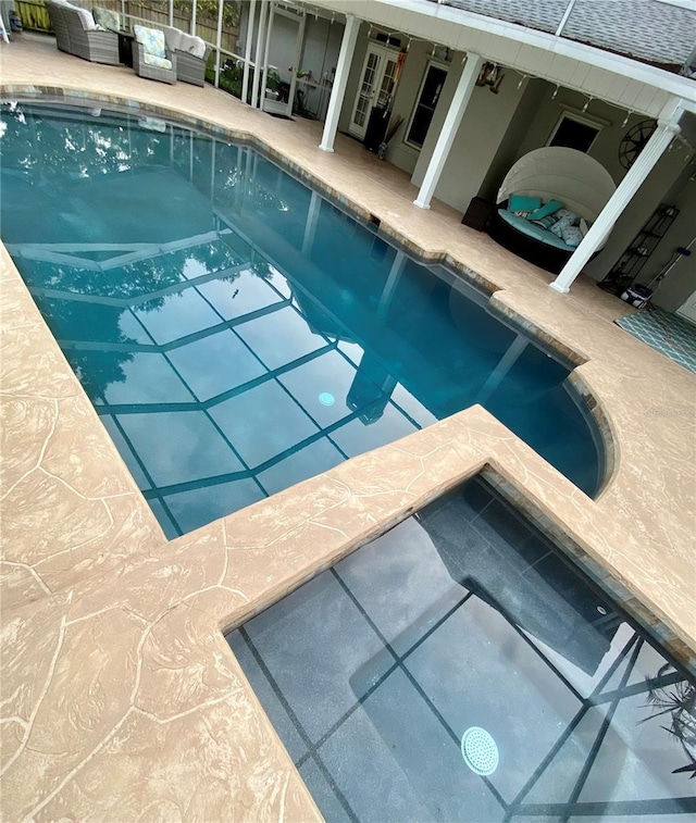3009 Ridgevale Cir, Valrico, FL 33596 - swimming pool featuring outdoor lounge area, a patio area, french doors, and a hot tub