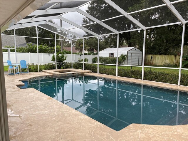 3009 Ridgevale Cir, Valrico, FL 33596 - view of swimming pool featuring a fenced backyard, a patio area, glass enclosure, and a pool with connected hot tub