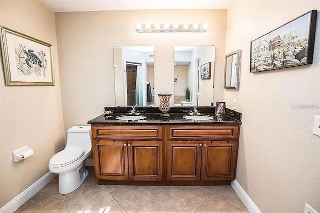 3009 Ridgevale Cir, Valrico, FL 33596 - bathroom with tile patterned flooring, double vanity, toilet, and baseboards