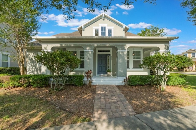 3223 Blazing Star Ln, Harmony, FL 34773 - view of front of property with a porch and stucco siding