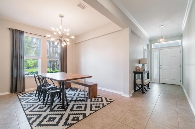 3223 Blazing Star Ln, Harmony, FL 34773 - dining area with light tile patterned floors, a chandelier, baseboards, and ornamental molding