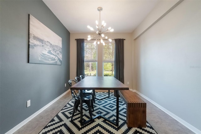 3223 Blazing Star Ln, Harmony, FL 34773 - dining area featuring a chandelier, light tile patterned floors, and baseboards