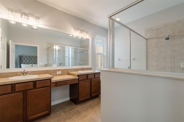 3223 Blazing Star Ln, Harmony, FL 34773 - bathroom featuring a stall shower, double vanity, and tile patterned flooring