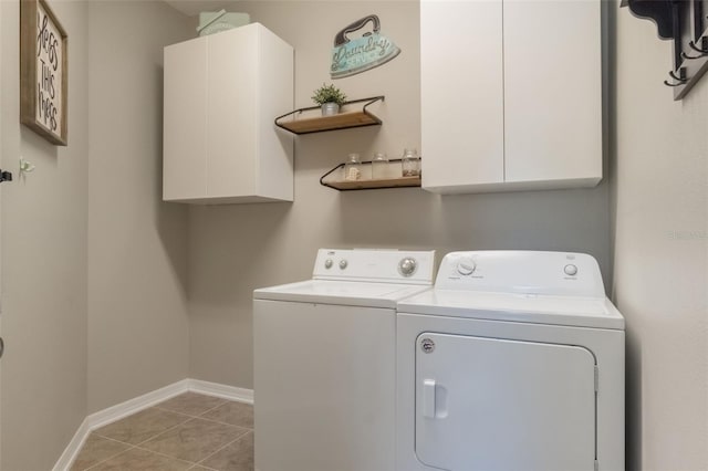 3223 Blazing Star Ln, Harmony, FL 34773 - washroom featuring cabinet space, washer and clothes dryer, baseboards, and light tile patterned floors