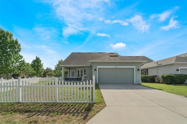 3223 Blazing Star Ln, Harmony, FL 34773 - ranch-style house featuring an attached garage, concrete driveway, stucco siding, and roof with shingles