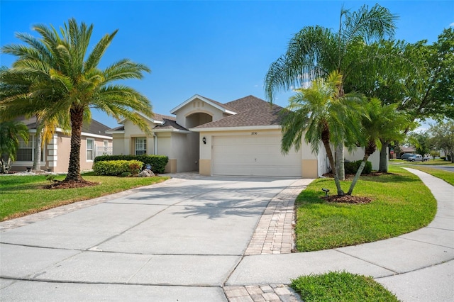 2830 Alton Dr, Kissimmee, FL 34741 - ranch-style house with stucco siding, a garage, a front lawn, and concrete driveway
