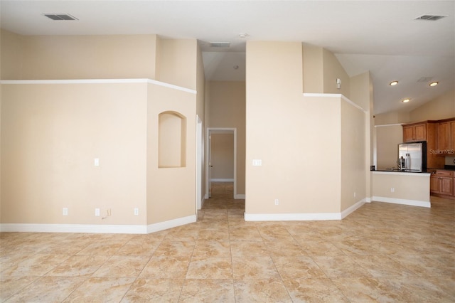 2830 Alton Dr, Kissimmee, FL 34741 - unfurnished living room featuring high vaulted ceiling, baseboards, and recessed lighting