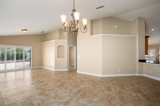 2830 Alton Dr, Kissimmee, FL 34741 - empty room featuring healthy amount of natural light, a chandelier, high vaulted ceiling, and baseboards