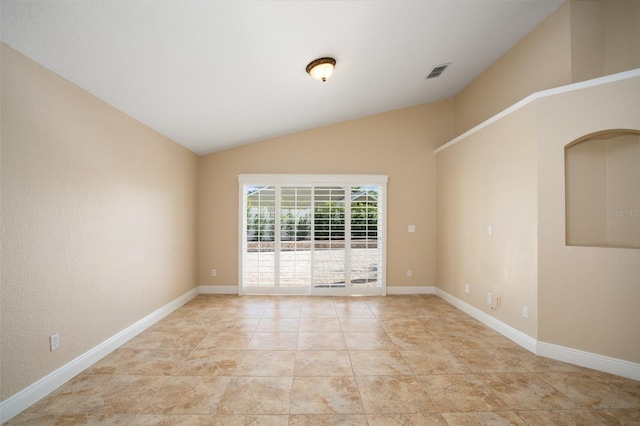 2830 Alton Dr, Kissimmee, FL 34741 - spare room with vaulted ceiling, baseboards, and light tile patterned floors
