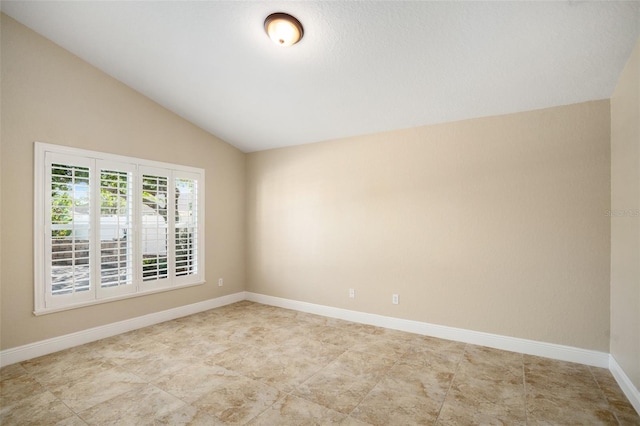2830 Alton Dr, Kissimmee, FL 34741 - unfurnished room with vaulted ceiling and baseboards
