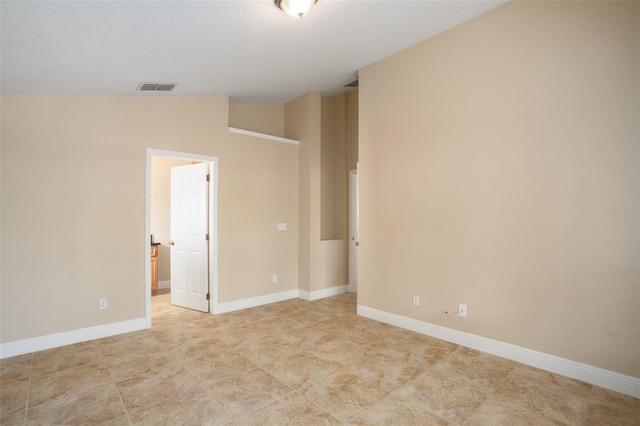2830 Alton Dr, Kissimmee, FL 34741 - unfurnished room featuring vaulted ceiling and baseboards