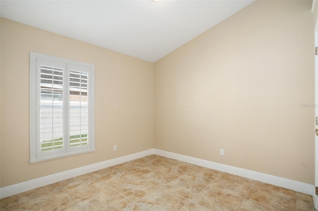 2830 Alton Dr, Kissimmee, FL 34741 - spare room with baseboards and vaulted ceiling