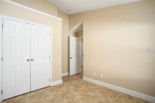 2830 Alton Dr, Kissimmee, FL 34741 - unfurnished bedroom with a closet and baseboards