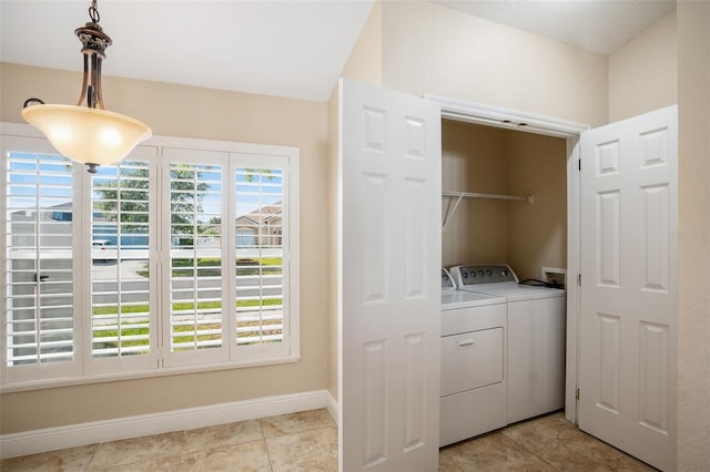 2830 Alton Dr, Kissimmee, FL 34741 - washroom featuring washer and dryer and baseboards