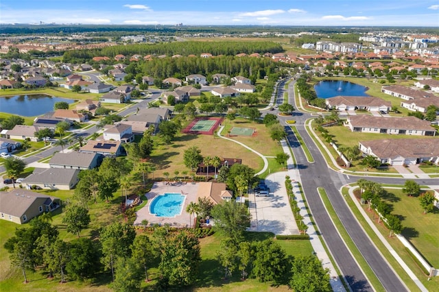 2830 Alton Dr, Kissimmee, FL 34741 - aerial view of property and surrounding area with a large body of water, nearby suburban area, and a pool