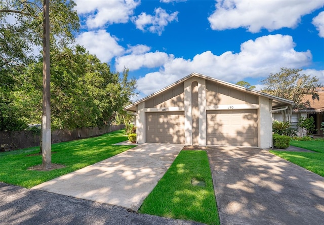 168 Hill St, Casselberry, FL 32707 - mid-century home with concrete driveway and a garage