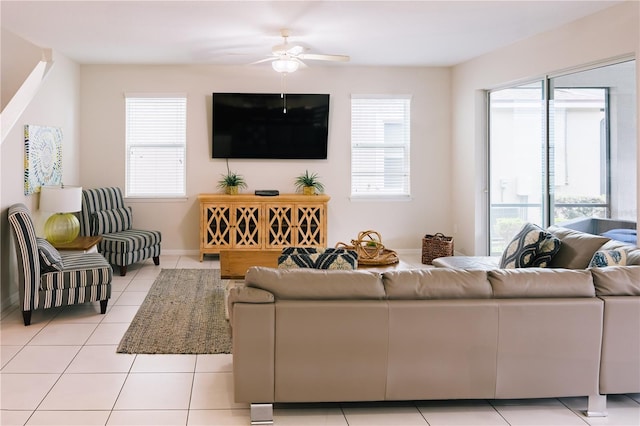 1836 Sandy Park Trl, Kissimmee, FL 34747 - living area with plenty of natural light, light tile patterned flooring, a ceiling fan, and baseboards