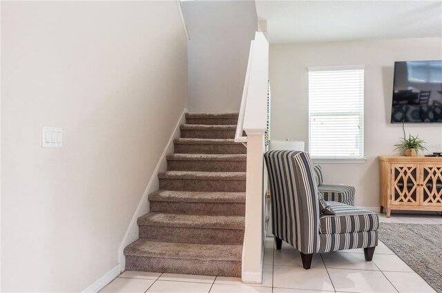 1836 Sandy Park Trl, Kissimmee, FL 34747 - staircase with tile patterned floors and baseboards