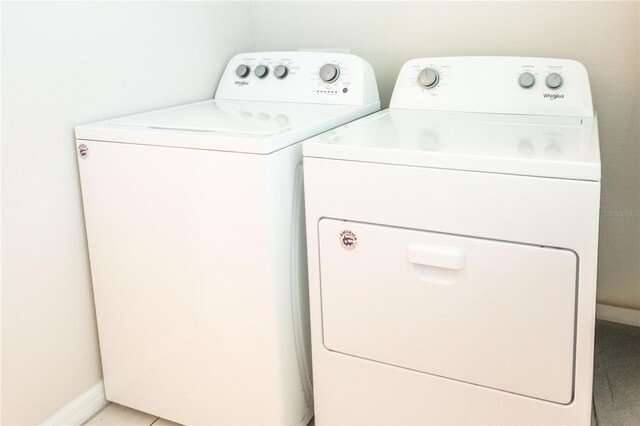 1836 Sandy Park Trl, Kissimmee, FL 34747 - washroom featuring separate washer and dryer and baseboards