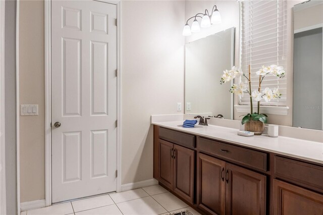1836 Sandy Park Trl, Kissimmee, FL 34747 - bathroom featuring vanity, tile patterned flooring, and baseboards