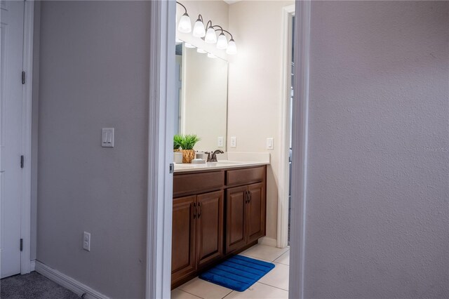 1836 Sandy Park Trl, Kissimmee, FL 34747 - bathroom featuring vanity, tile patterned floors, and baseboards