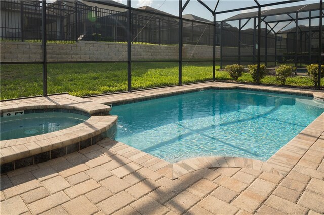 1836 Sandy Park Trl, Kissimmee, FL 34747 - view of pool featuring glass enclosure, a patio, and a pool with connected hot tub