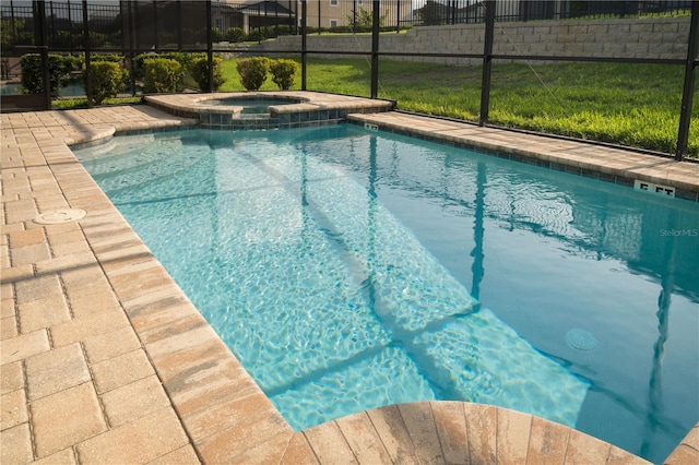 1836 Sandy Park Trl, Kissimmee, FL 34747 - view of swimming pool featuring a lanai, a pool with connected hot tub, and a patio area