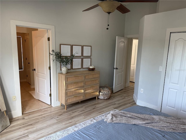 7544 Red Mill Cir, New Port Richey, FL 34653 - bedroom featuring wood finished floors, a high ceiling, baseboards, and a ceiling fan